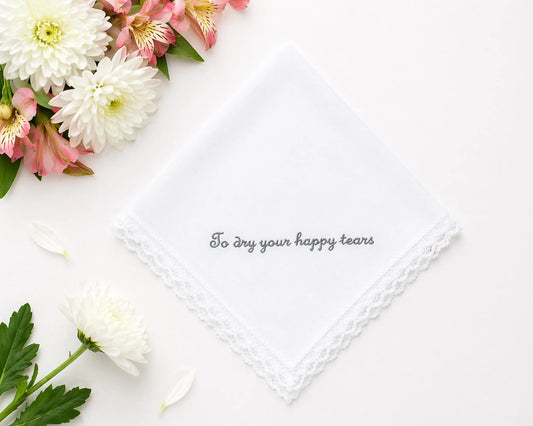 Floral arrangement with a white handkerchief and text on a white background