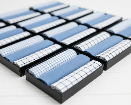 Set of folded blue and white checkered hanky in a grid on a light gray background