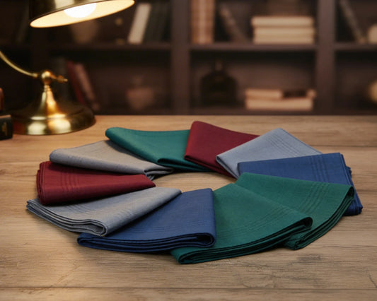 Set of folded colorful hanky on a wooden surface with a blurred background