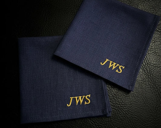 White cotton wedding hanky featuring blue script poetry and a small embroidered heart near pink roses