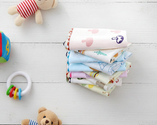 Soft multi layered cotton gauze face cloth for infants featuring whimsical desert and forest illustrations