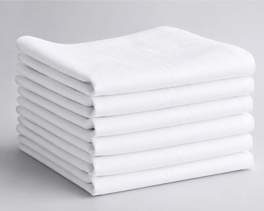 Stack of white folded hanky on a gray background