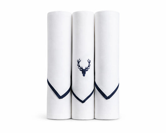 Three white handkerchiefs with navy blue hems and a deer emblem on a white background