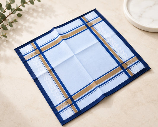Blue checkered placemat on a light surface with a plant in the corner