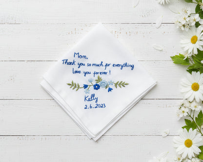 White cotton handkerchief featuring blue floral vine embroidery and a personalized thank you message for mom