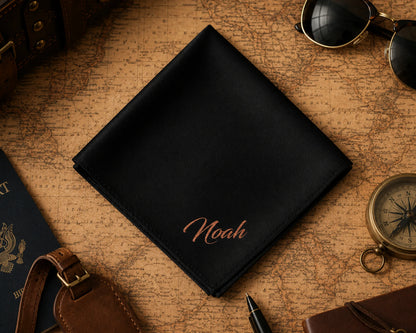 Black leather wallet with 'Noah' embroidery on an old map background