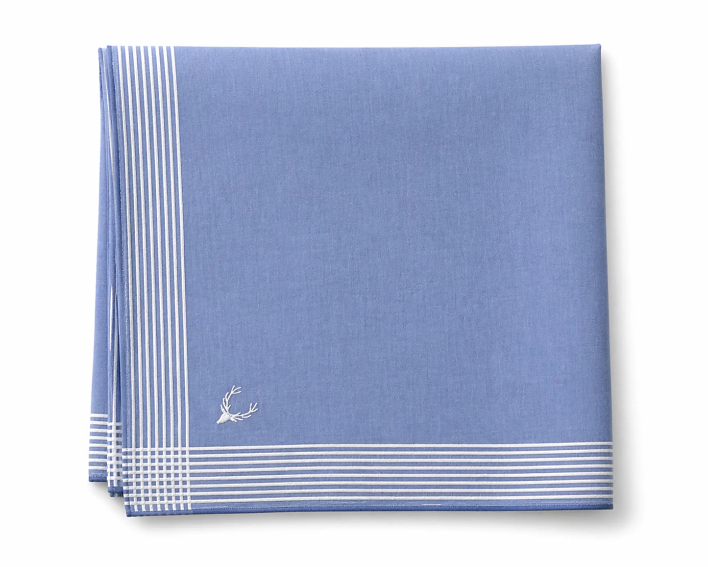 Blue napkin with white stripes and a small emblem on a white background