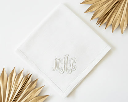White cotton handkerchief for women featuring a light blue embroidered letter W with vine accents and intricate lace