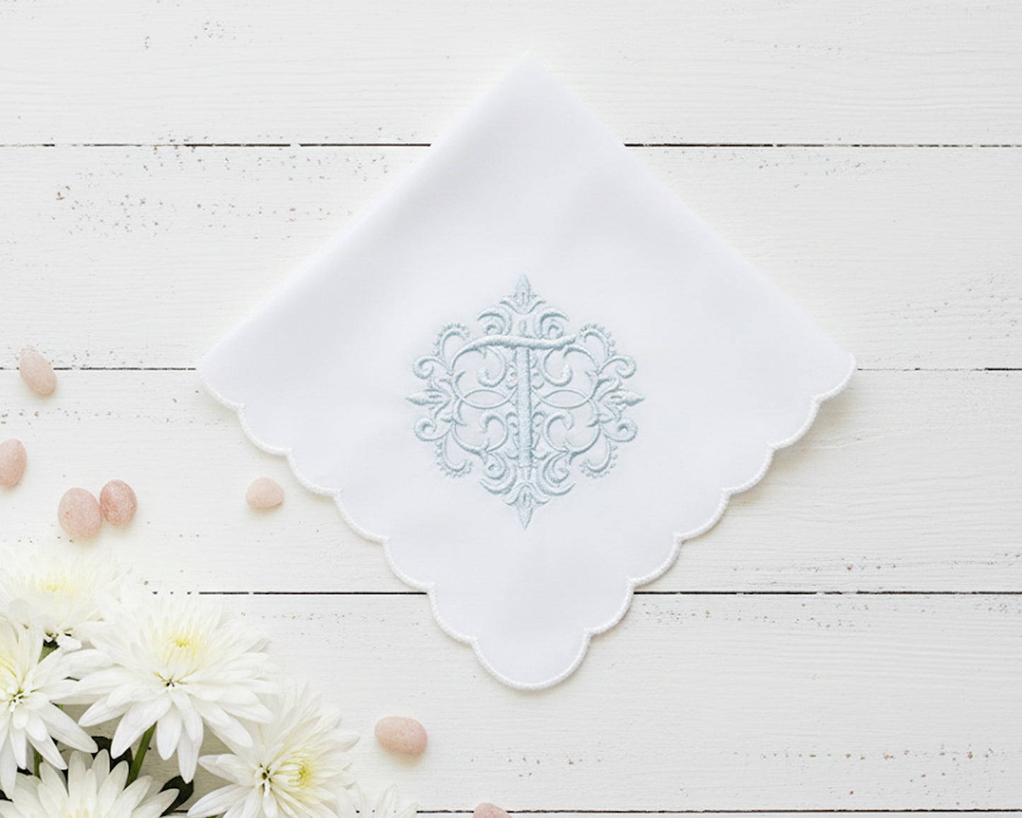 White cotton hanky for women featuring a blue embroidered letter W with vine accents and wide lace borders