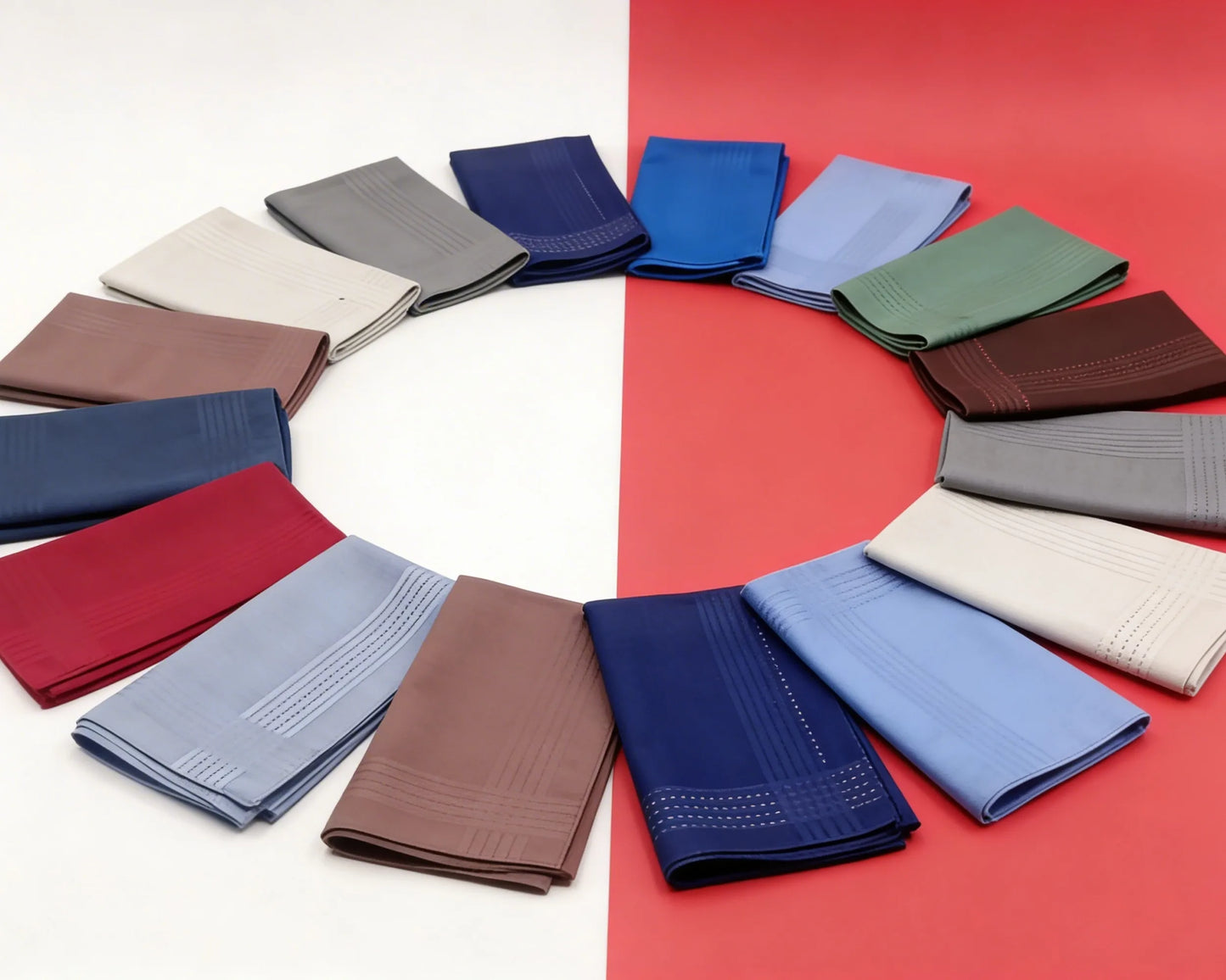 Circular arrangement of folded blue, white, and navy hanky  on a white surface.