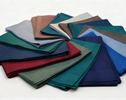 Collection of folded hanky in various colors on a white background