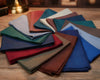 Collection of hanky in various colors on a wooden surface