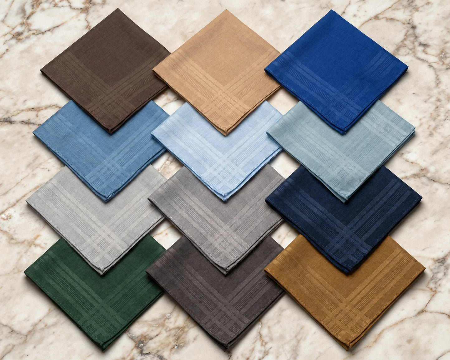 Collection of square hanky samples in various colors on a marble surface