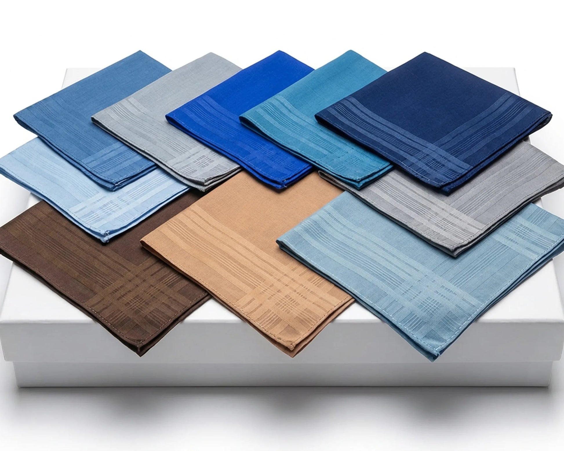 Collection of various blue and brown handkerchiefs on a white surface