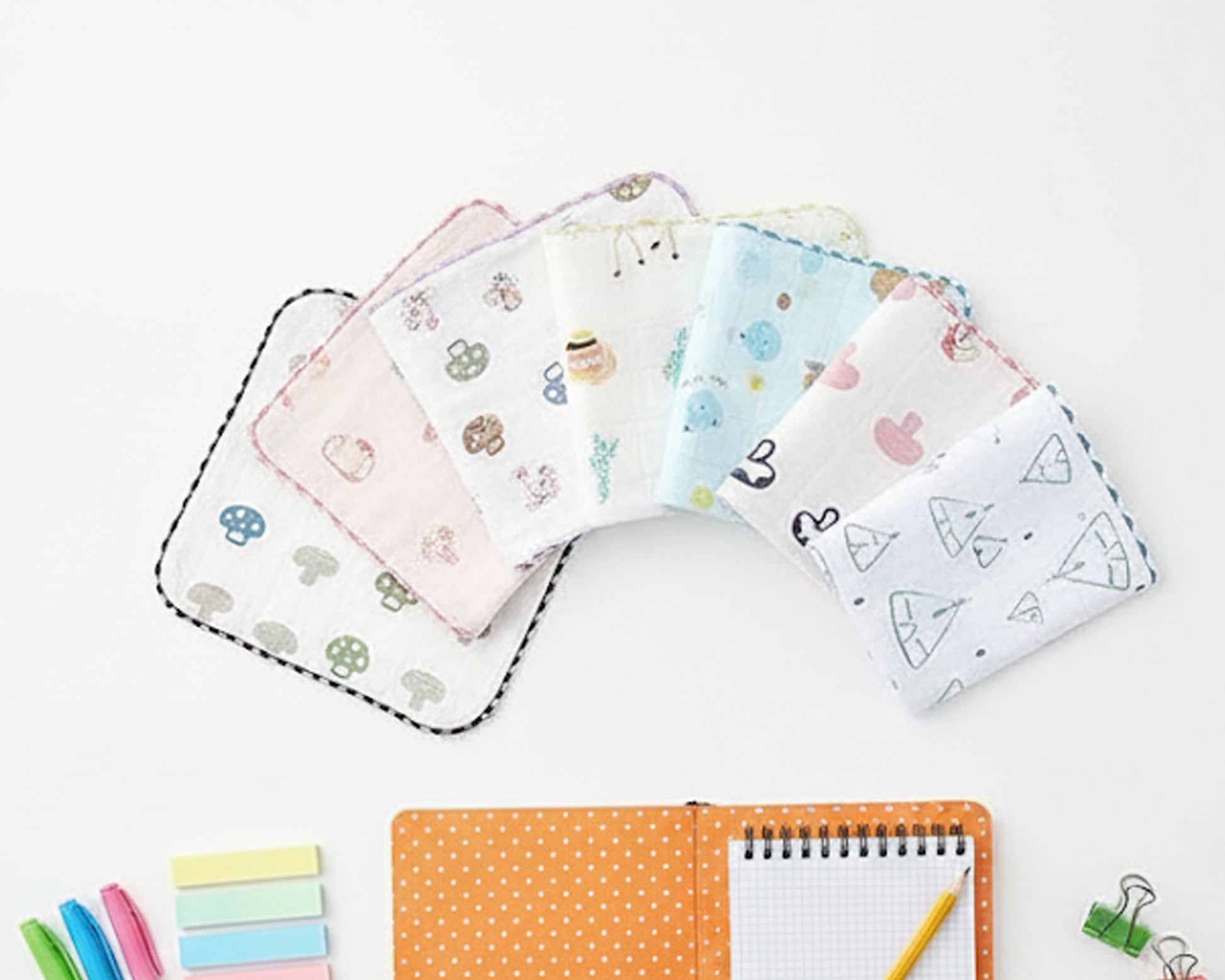 White baby muslin handkerchief with colorful mushroom and animal prints made in the usa