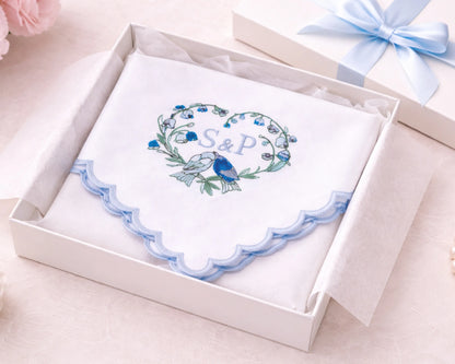 Decorative card with floral design and initials 'S&P' in a white box with a blue ribbon.