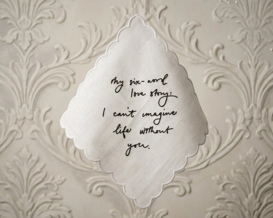 Decorative paper with a six-word love story on an ornate background