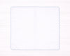 Decorative white scalloped edge hanky border on a light wooden background
