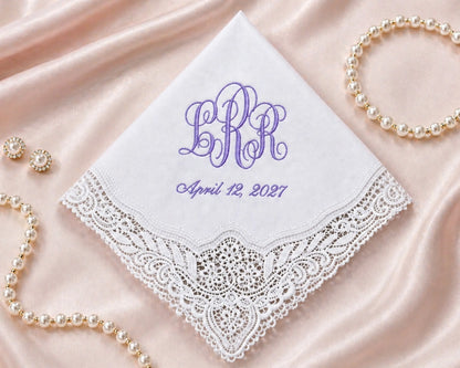 Embroidered handkerchief with monogram and date on a satin background