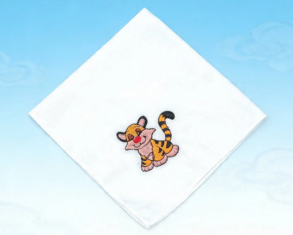 Embroidered patch of a cartoon tiger on a white fabric square with a blue background