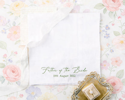 Floral-themed hanky with 'Father of the Bride' text and ring box on a floral background