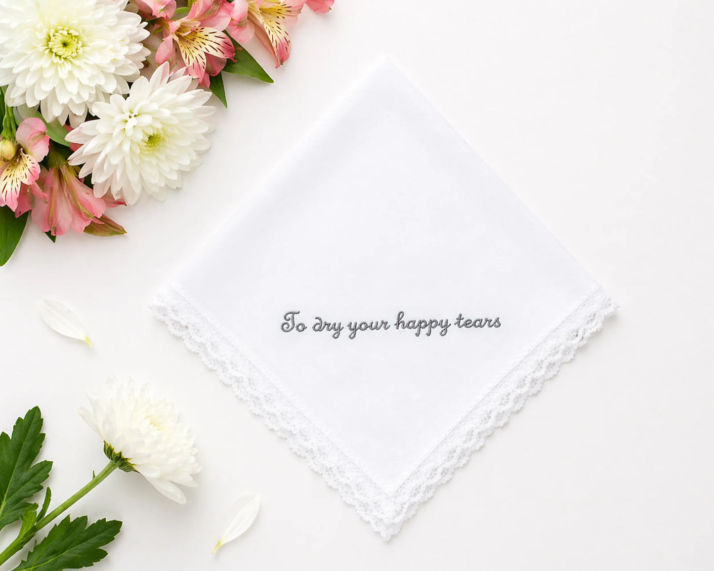Floral arrangement with a white handkerchief and text on a white background