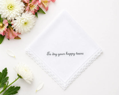 Floral arrangement with a white handkerchief and text on a white background