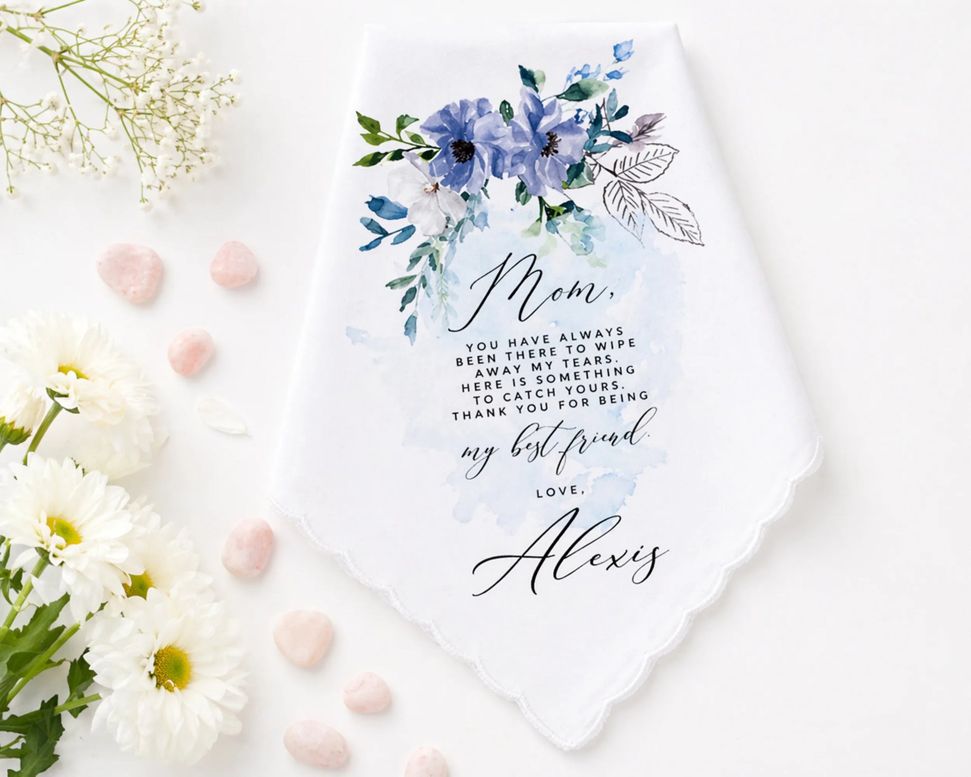 Floral hanky with a message to 'Mom' on a white background with flowers and pink stones.