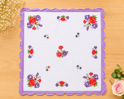 Floral printed hanky  on a wooden surface with decorative elements.
