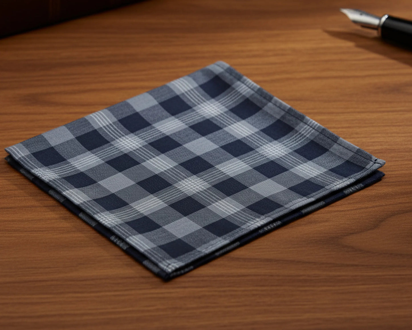 Folded checkered fabric on a wooden surface