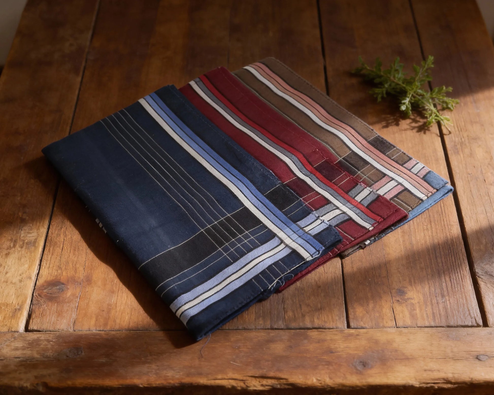 Folded fabric with striped pattern on a wooden surface