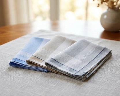 Folded striped hanky on a textured surface with a blurred background