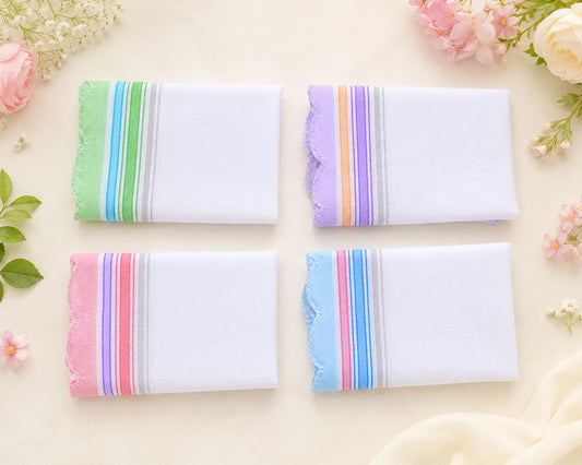 Four folded hanky with colorful stripes on a light background with flowers.