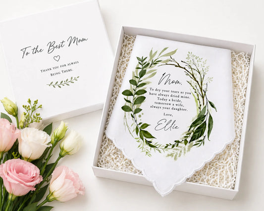 Gift box with a personalized towel and flowers on a white background
