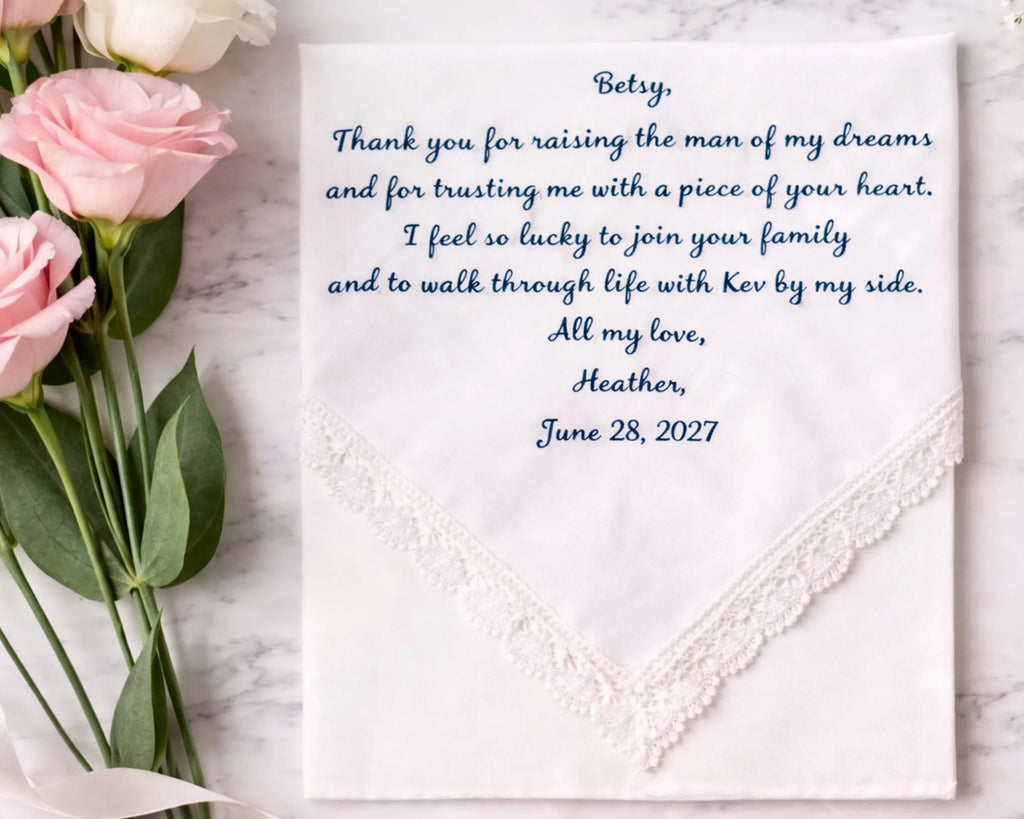 Hankie with embroidered message and pink roses on a marble surface