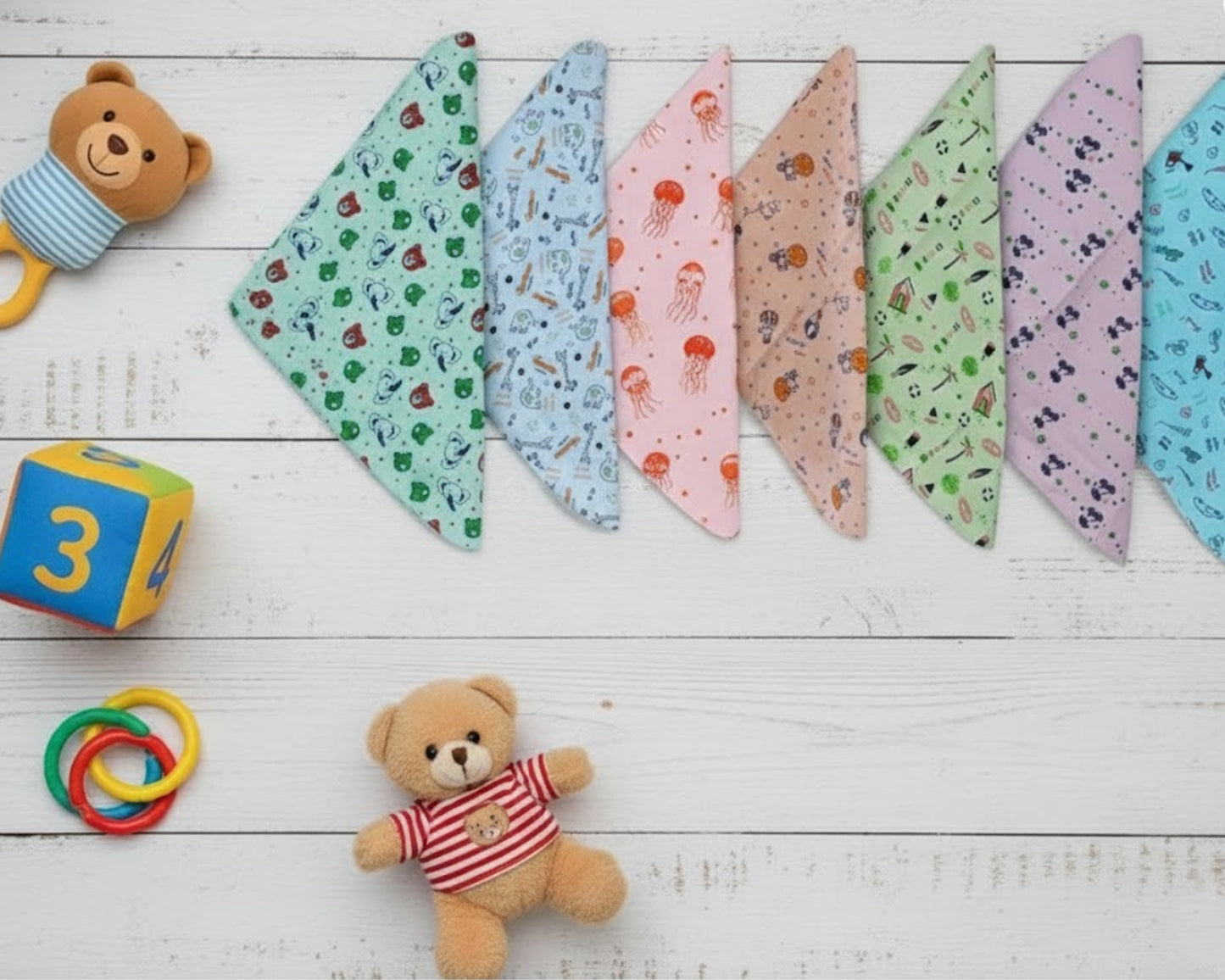 Row of colorful kids cotton handkerchiefs with jellyfish and elephant prints made in the usa