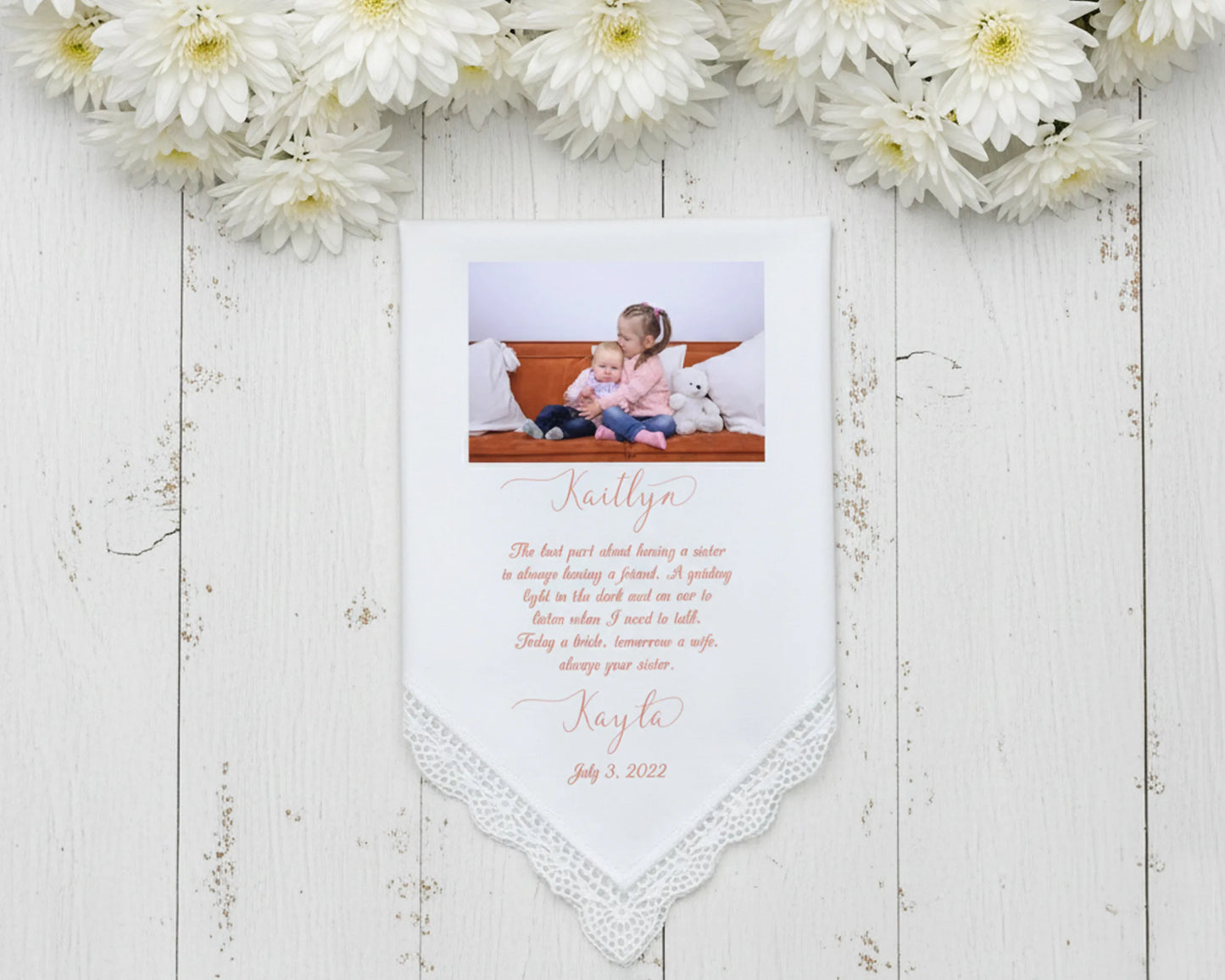 White lace trimmed handkerchief featuring a color photo of a bride with both parents and a congratulatory wedding day message