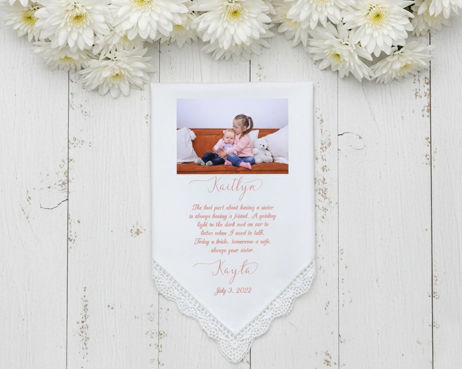 White lace trimmed handkerchief featuring a color photo of a bride with both parents and a congratulatory wedding day message