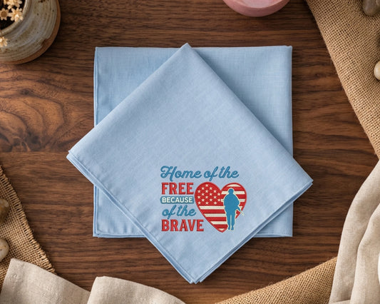Light blue hanky with a printed design on a wooden surface