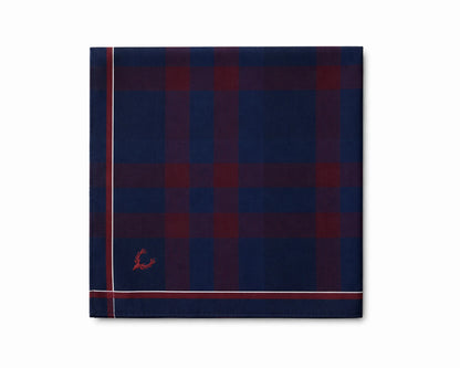 Navy and red checkered pocket square with a small logo on a white background