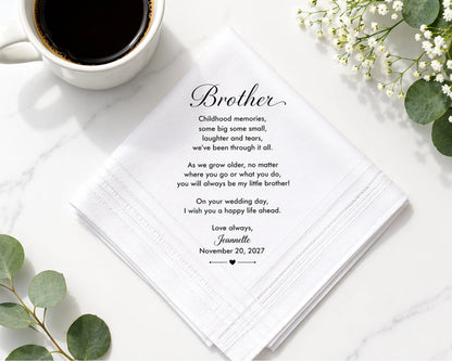 Open book with a heartfelt message to a brother, a cup of coffee, and flowers on a white surface.
