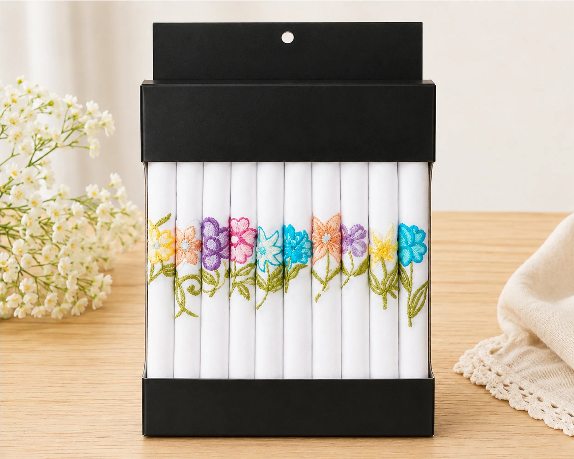 Pack of colorful flowers on a wooden surface with a light background