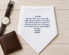 Personalized handkerchief with a message to a grandpa, placed next to a watch and wallet on a wooden surface.