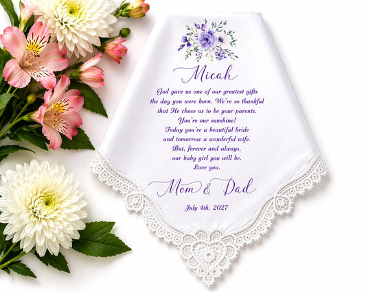 Personalized handkerchief with floral design and text on a white background with flowers.