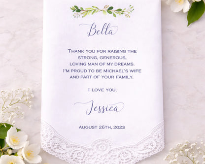 Personalized handkerchief with romantic message on a wooden surface with flowers