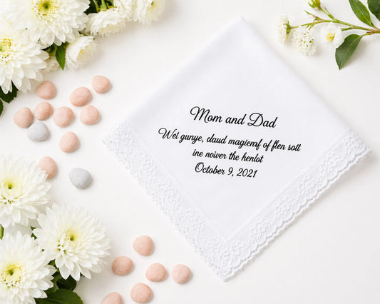 Personalized handkerchief with text print surrounded by flowers and candies on a white background