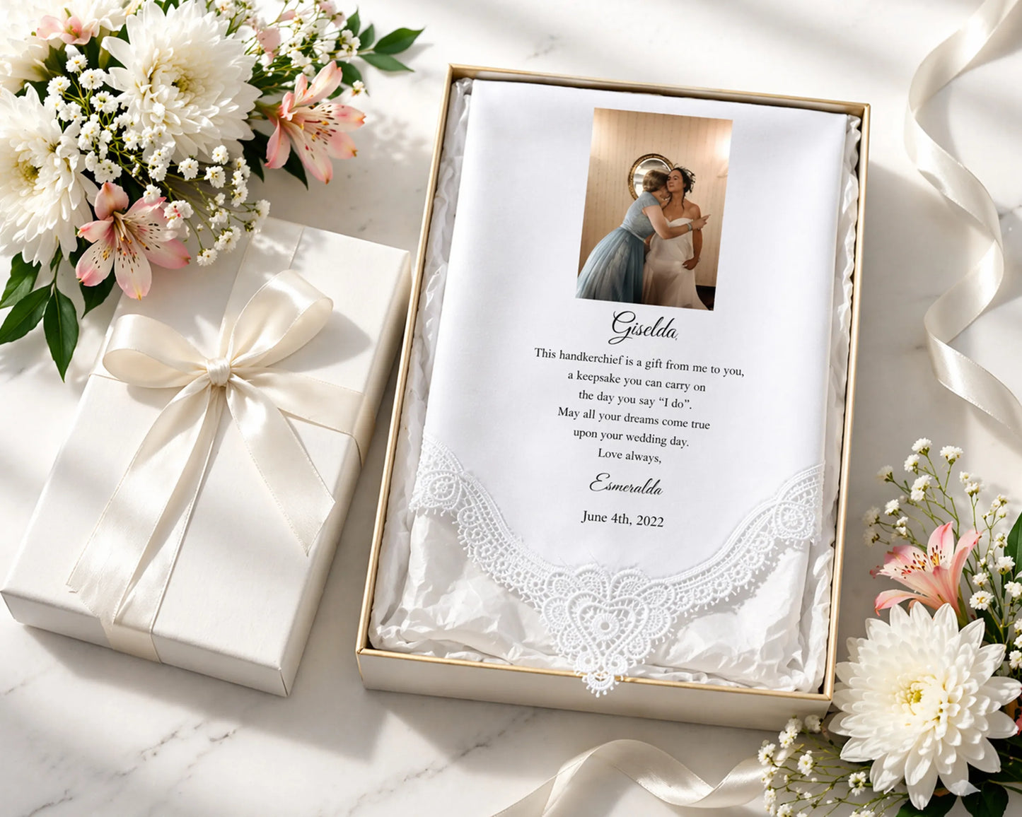 Personalized lace hanky in a box with floral decorations on a light surface