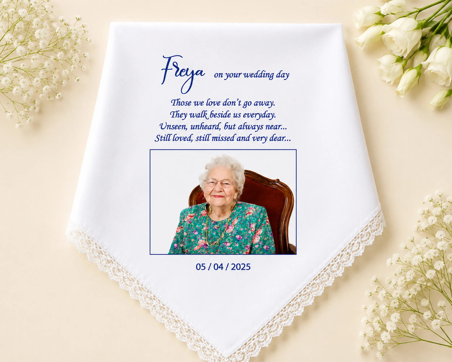 Personalized wedding handkerchief with a photo of an elderly woman and text on a beige background with flowers.