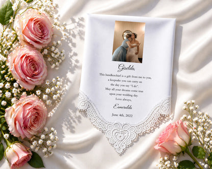 Personalized wedding handkerchief with lace edge, photo of couple, and text on a white fabric background with pink roses.