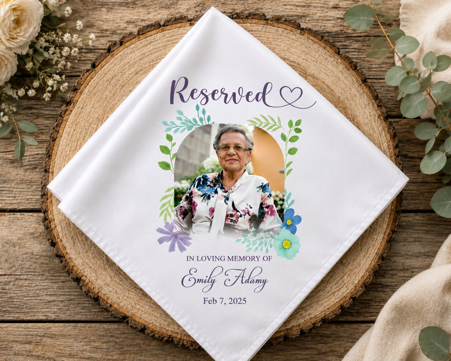 Personalized wedding hanky with photo and text on a wooden surface with flowers.